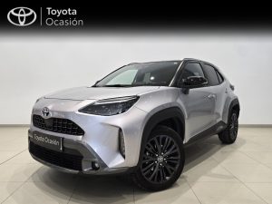 Silver Toyota SUV in a showroom, front-left angle with prominent grille and black wheel arches, 'Toyota Ocasión' sign in the background